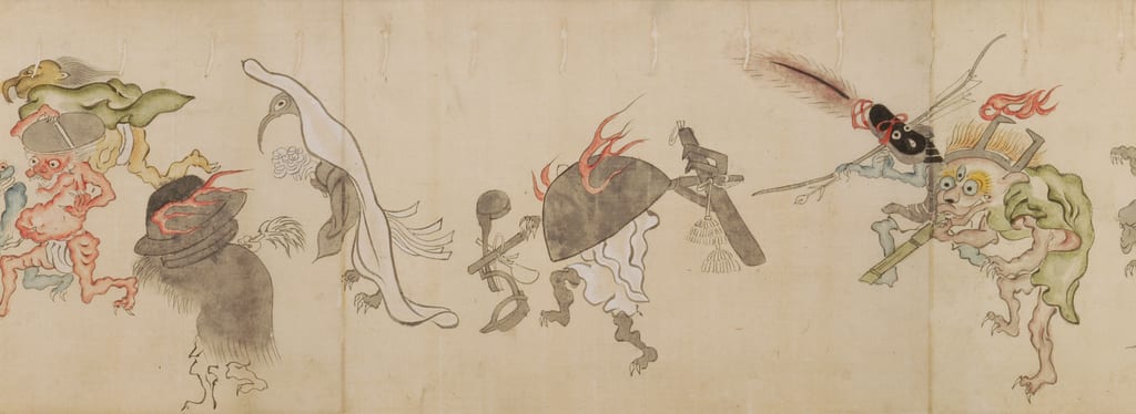 Cropped horizontal detail from a Hyakki Yagyō Emaki scroll at Nichibunken: a white crane-like creature moves in the procession holding a cluster of small bells.